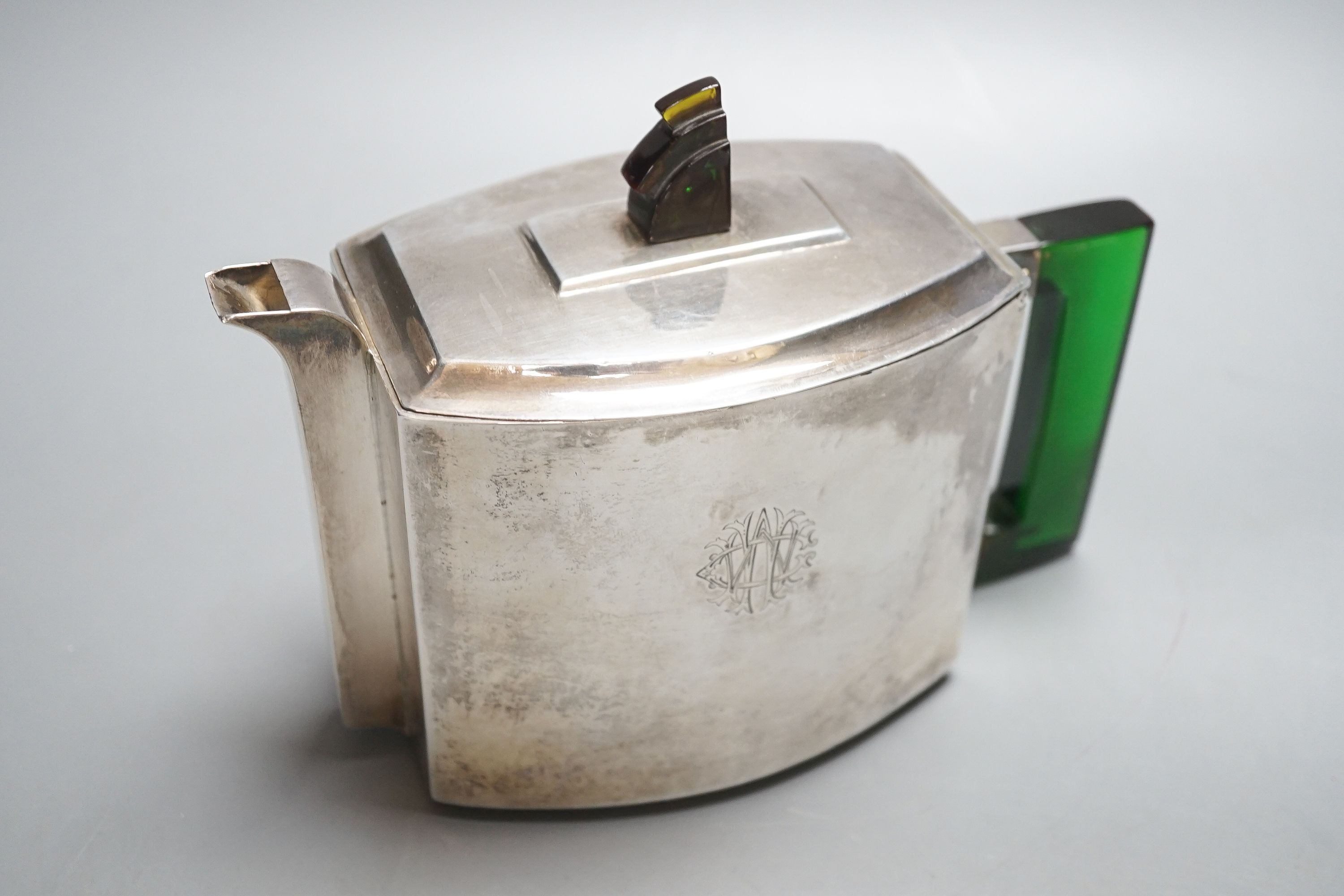 An Anglo Indian Art Deco metal teapot, with acrylic handle and finial, H 14cm